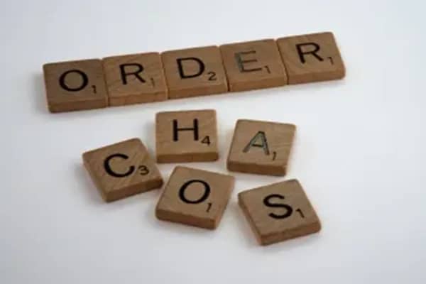 scrabble pieces spelling our order chaos 