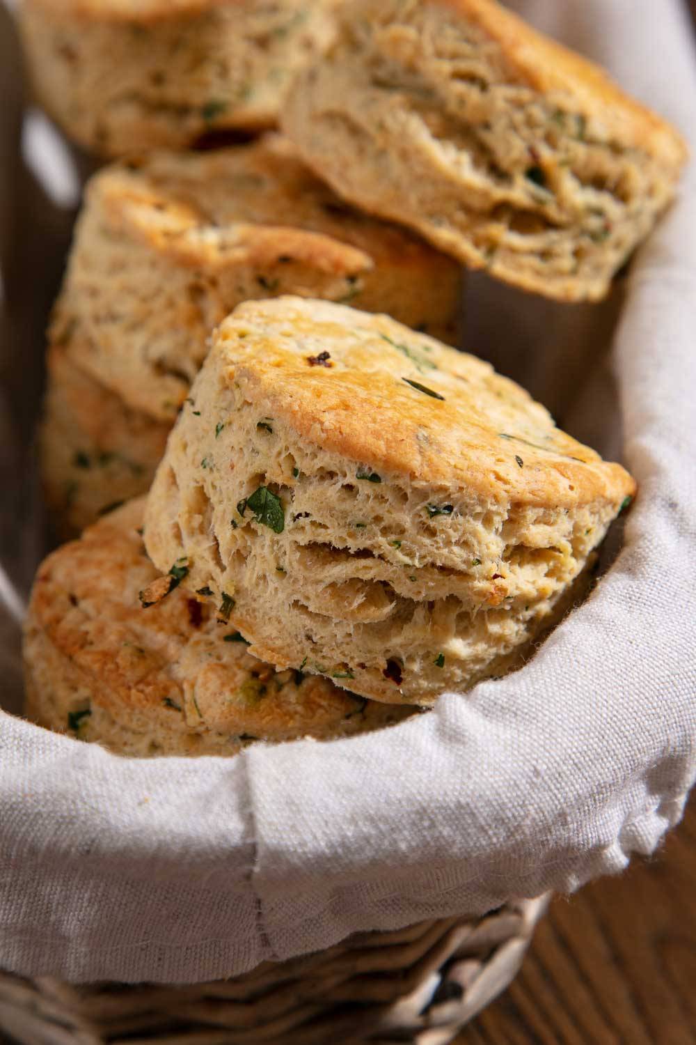 Browned and fluffy vegan scones in a basket.