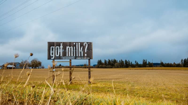 a sign in a field that says got milk?