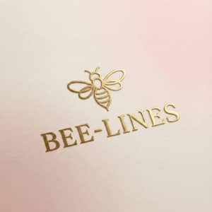 Gold Bee-Lines logo with a bee icon on a soft blush and cream textured background.