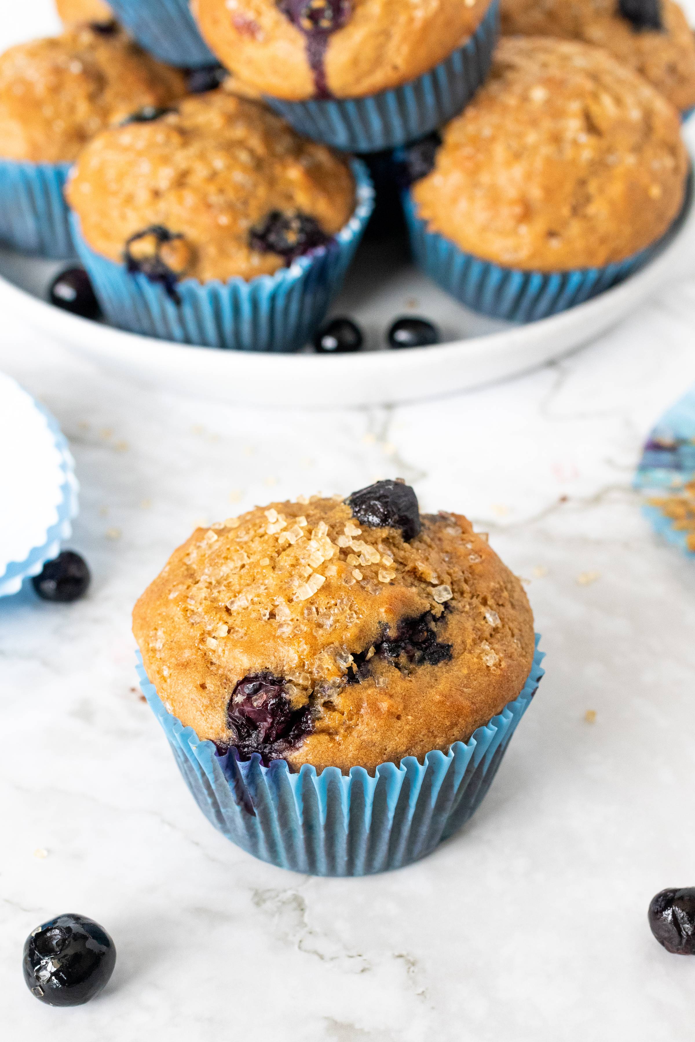 blueberry Greek yogurt muffin in a blue muffin liner