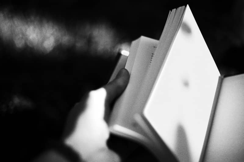 A person holding a book in their hands