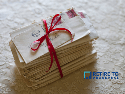 Stack of envelopes tied in red ribon