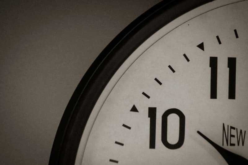 A close view of a clock face showing the numbers ten and eleven