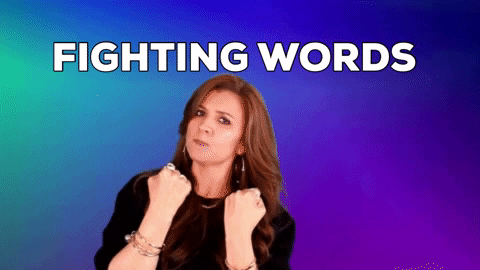 A woman throwing punches with a mock serious face under the words "fighting words"