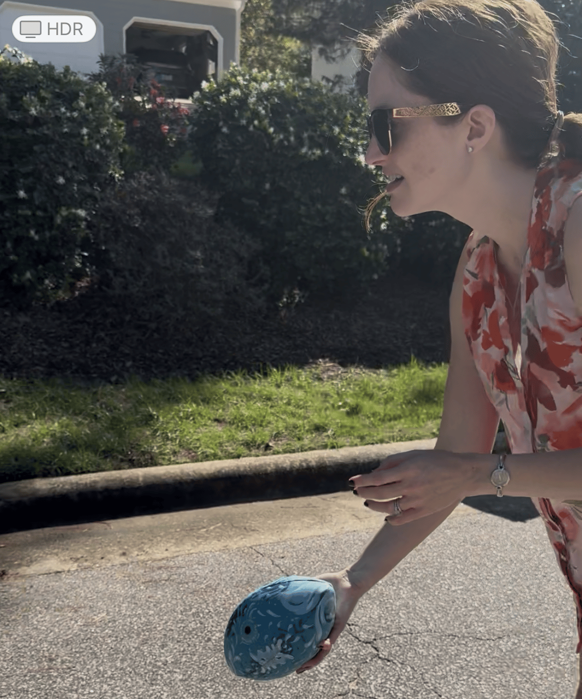Lee preparing to toss a blue football