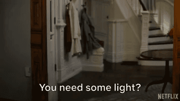 Dolly Parton appears in a cloud of sparkles and asks, "You need some light?"