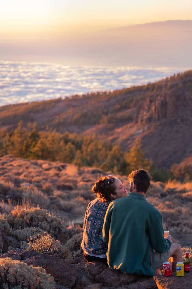 Couple enjoys the sunset with beautiful views.