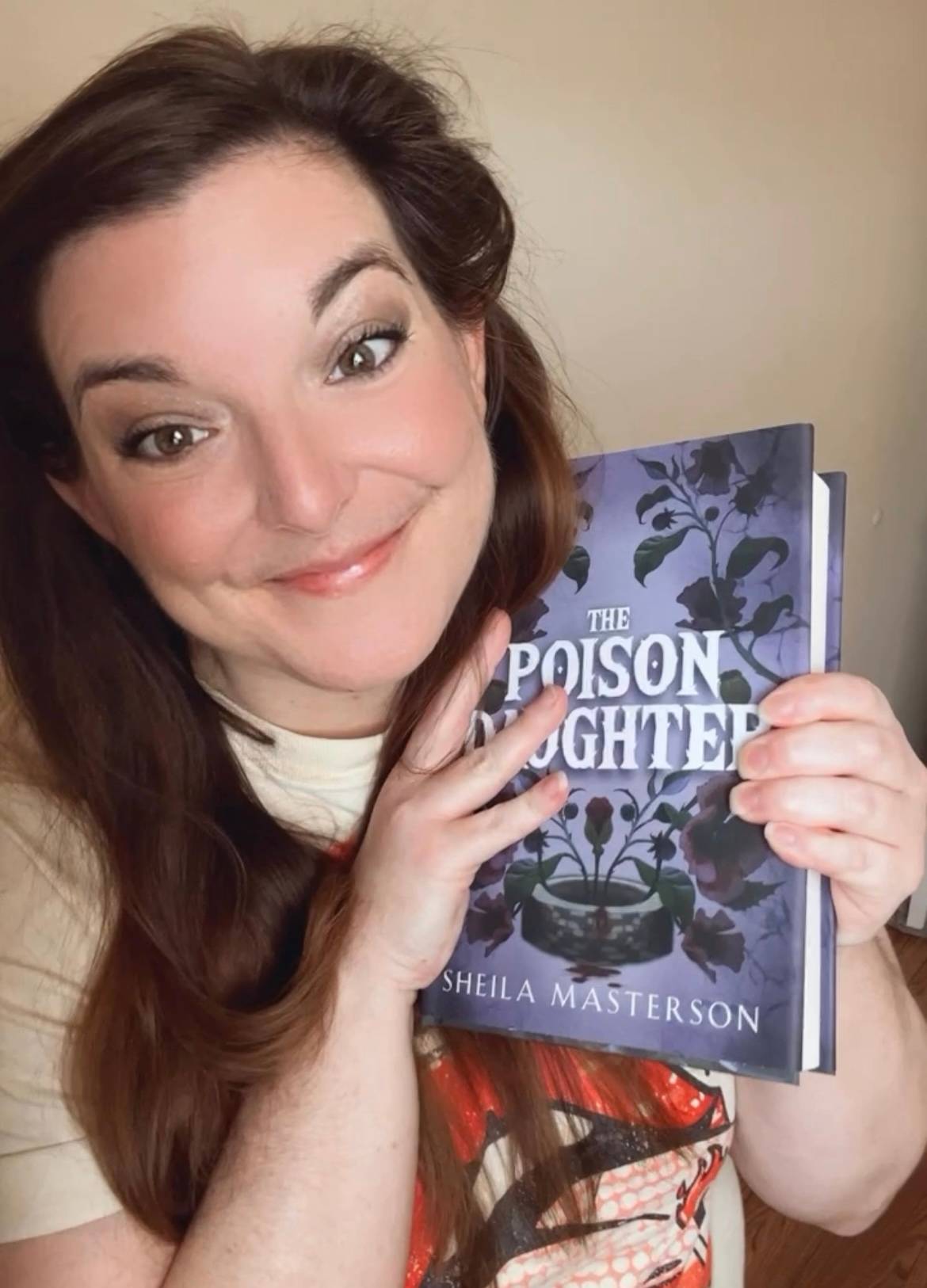 Sheila holding the hardcover of TPD