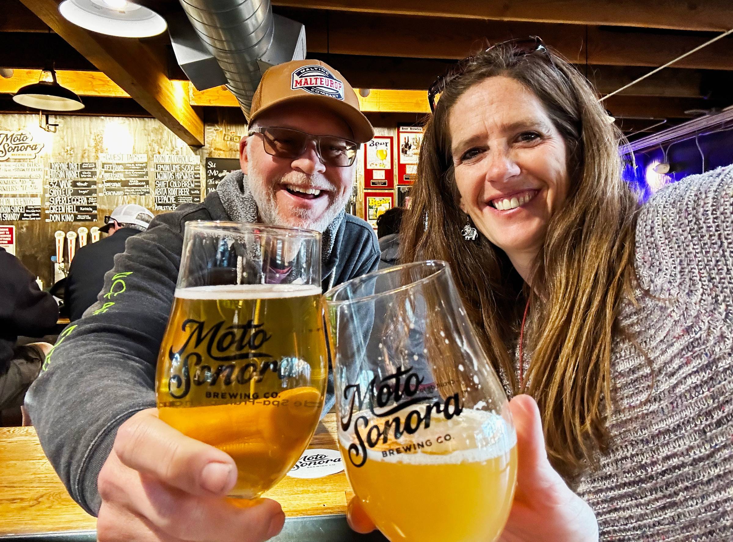 Ken and April with a beer