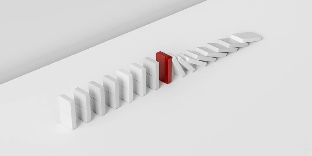 Domino effect caused by a red domino.