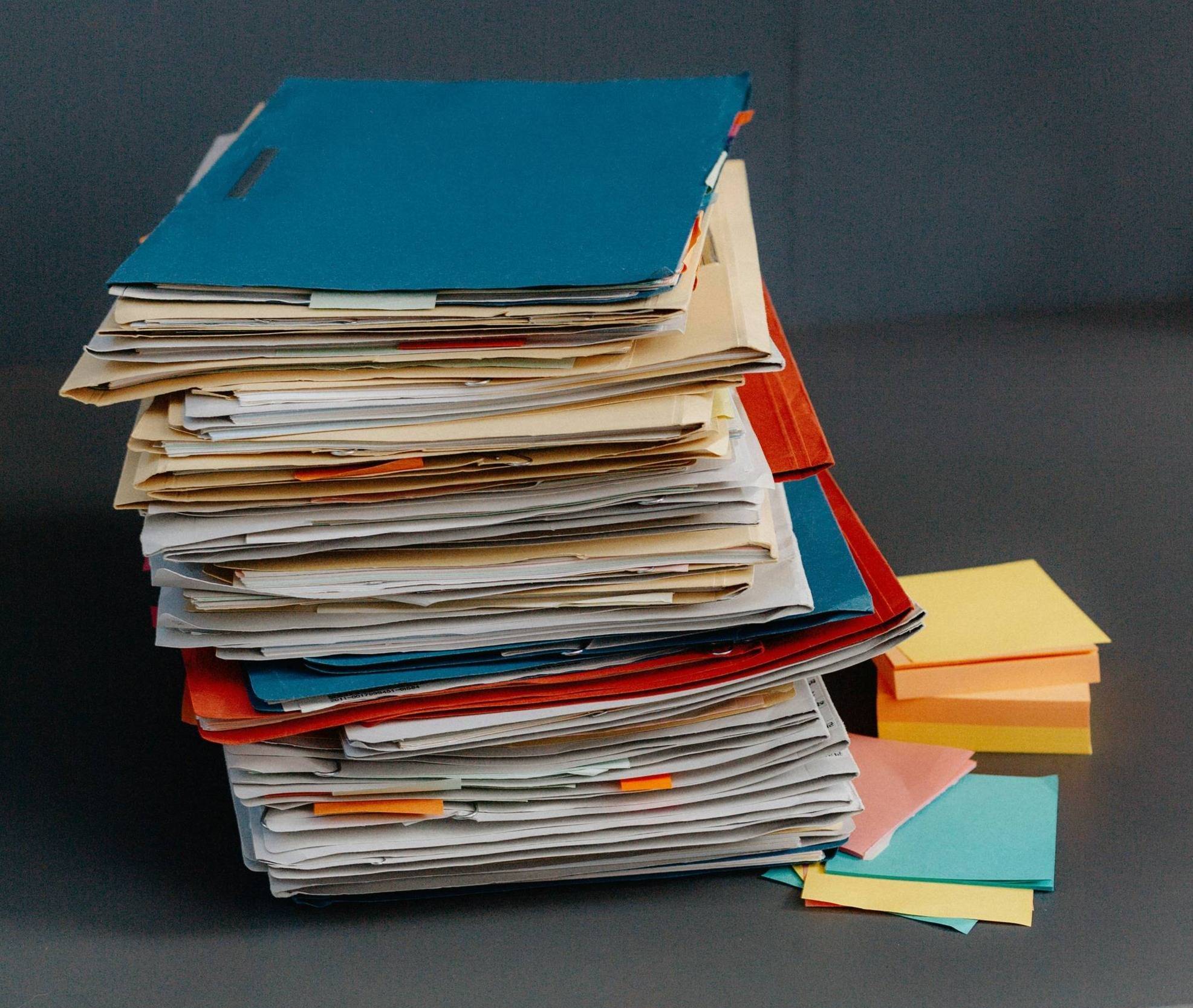 A stack of papers on a table.