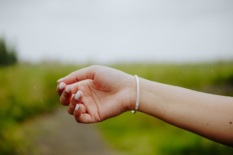 A woman's arm with a bracelet on it