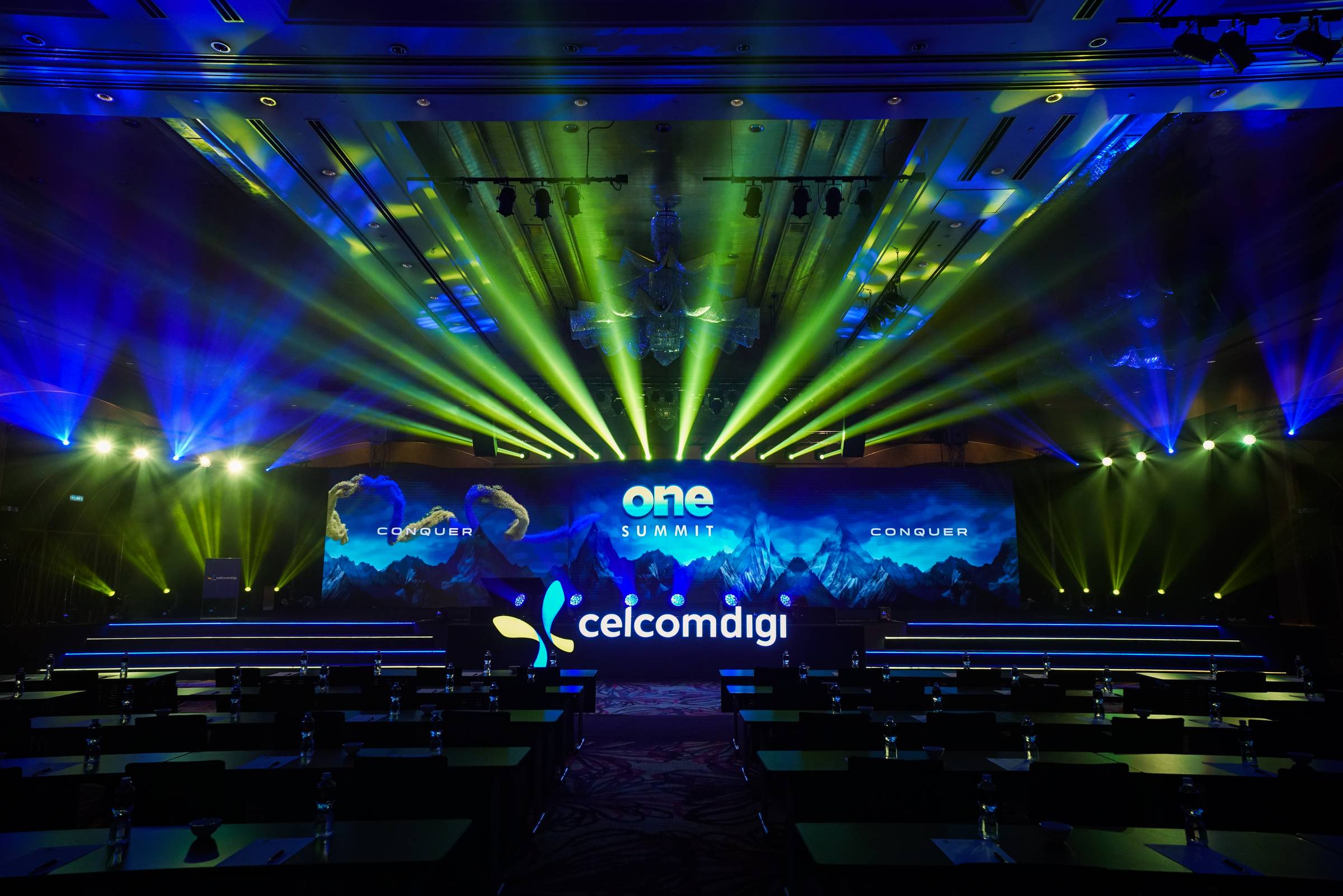 A man standing in front of a purple moon