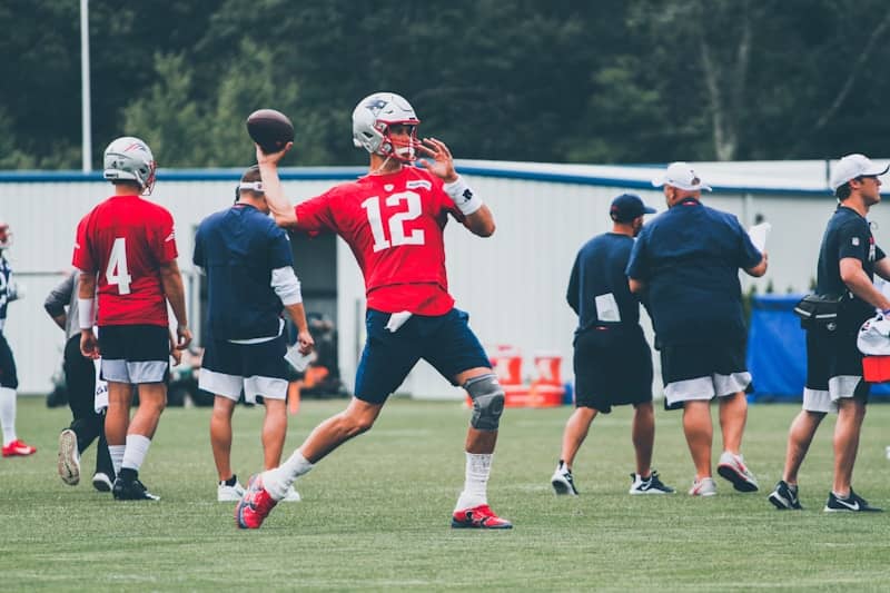 Tom Brady playing football