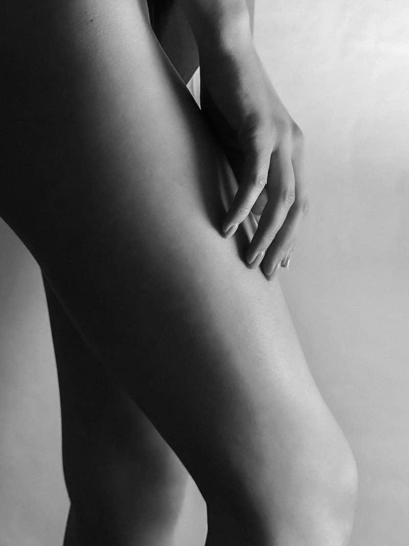 A close-up black and white of a woman's legs.