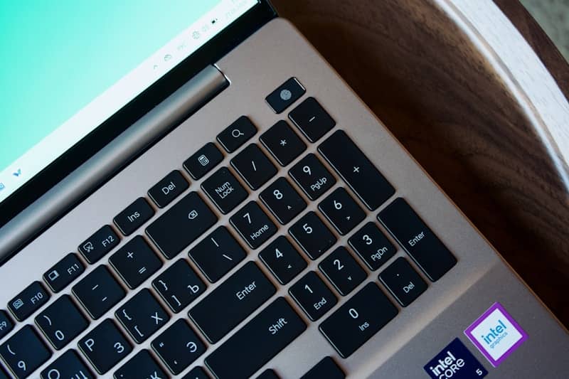 Laptop keyboard and screen with intel stickers.