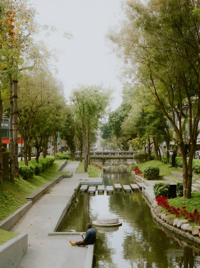 A serene park scene with a waterway.
