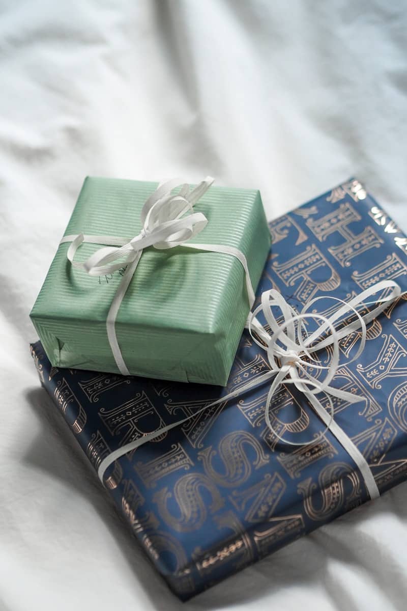 Two wrapped presents sitting on top of each other