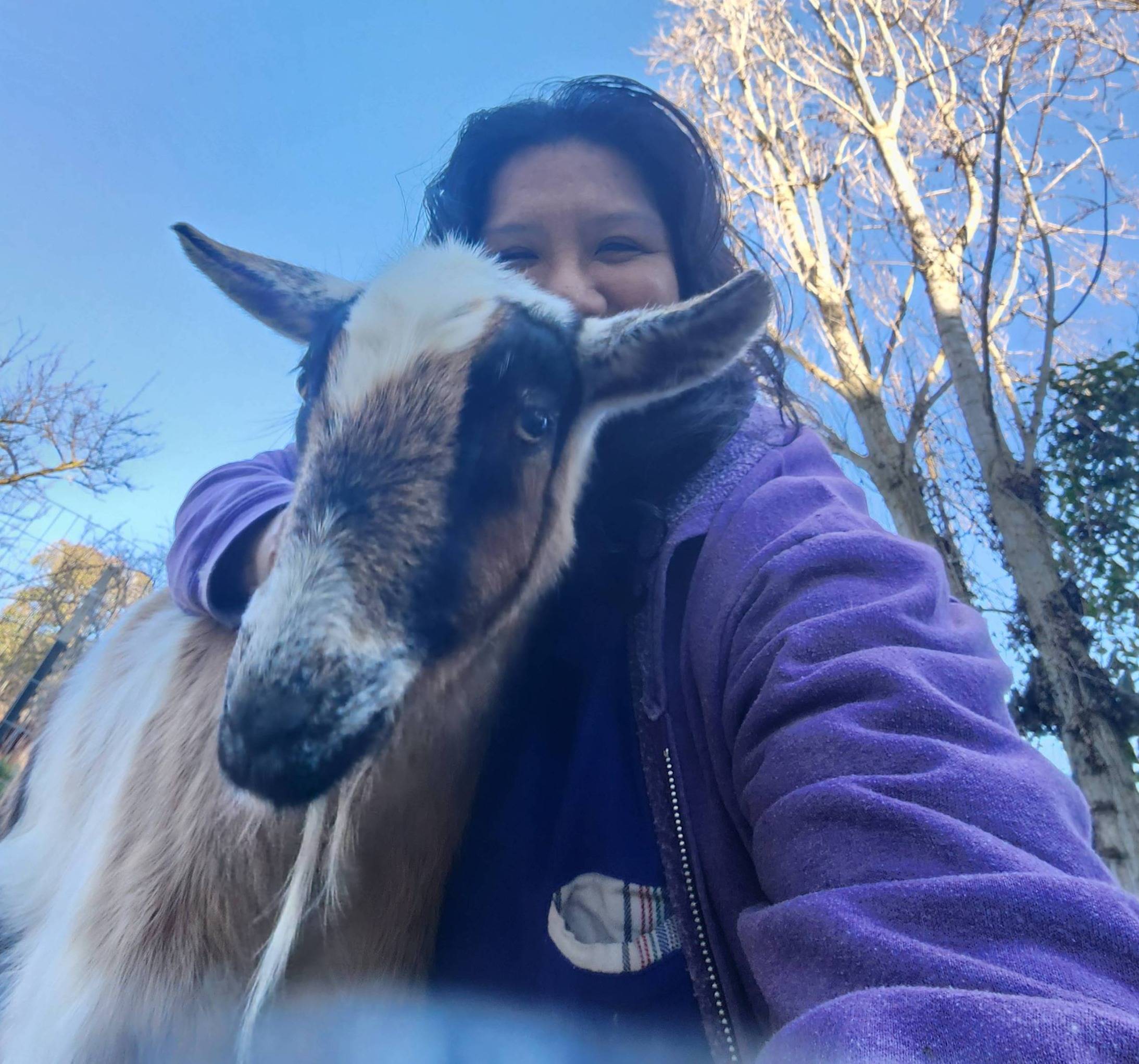 Gail hugging a goat