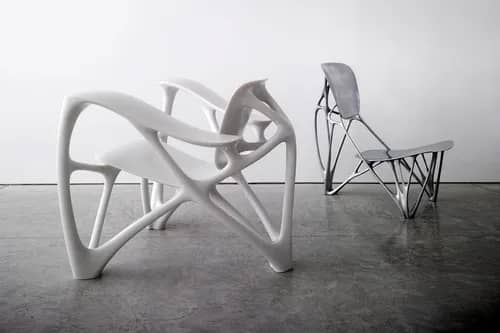 Chairs by designer Joris Laarman. These chairs have material removed in the back and legs, giving them an open feel.