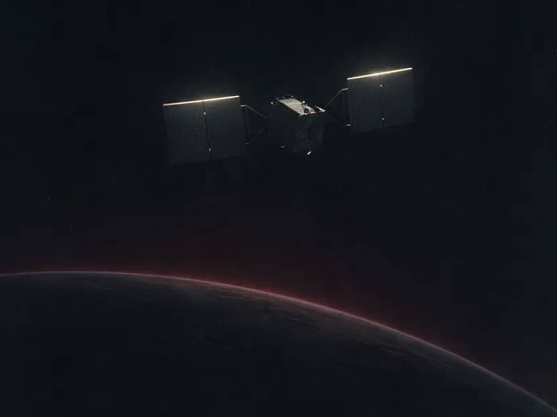 Noir illustration of a satellite with lit solar panels orbiting above the dark curve of Earth