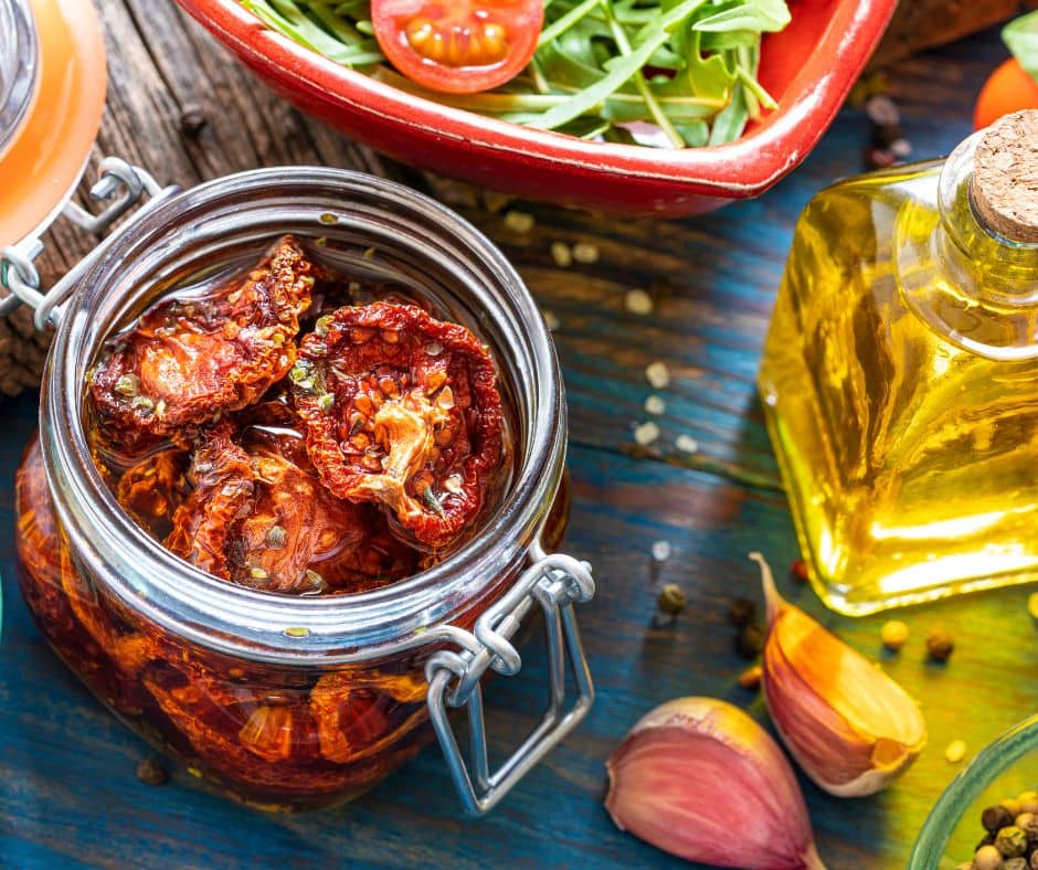 Sundried tomatoes preserved in a jar with oil.
