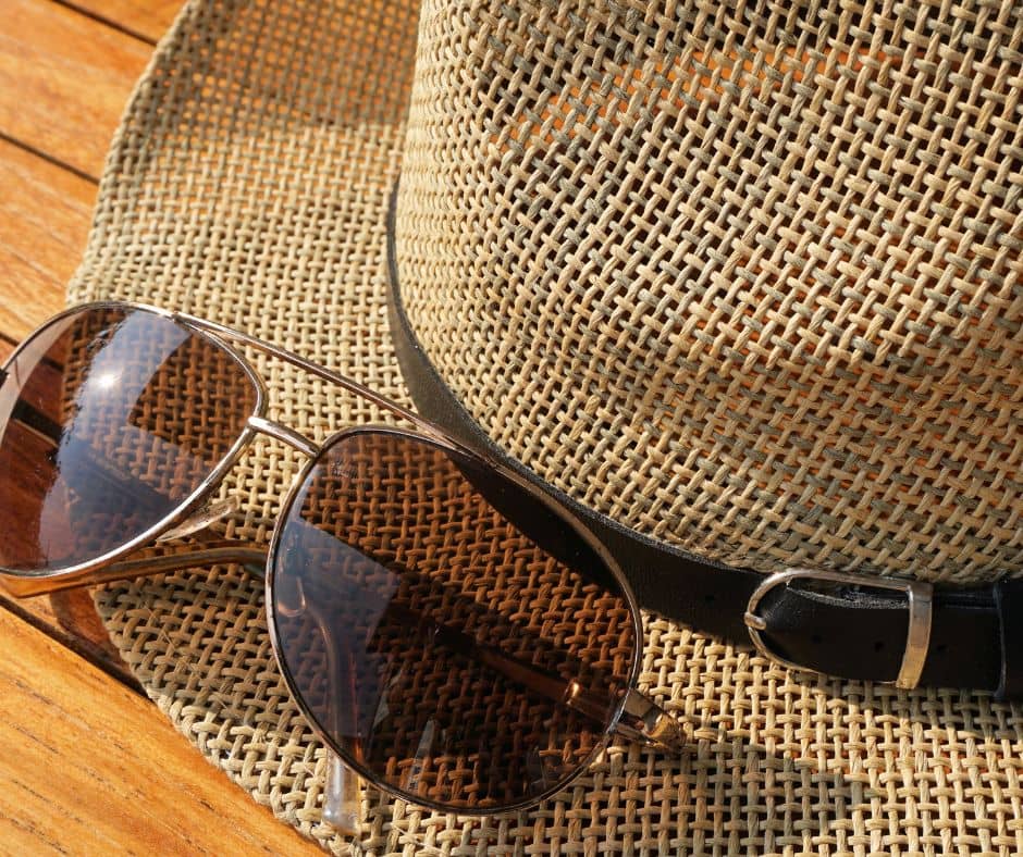 Sunglasses on a straw hat.