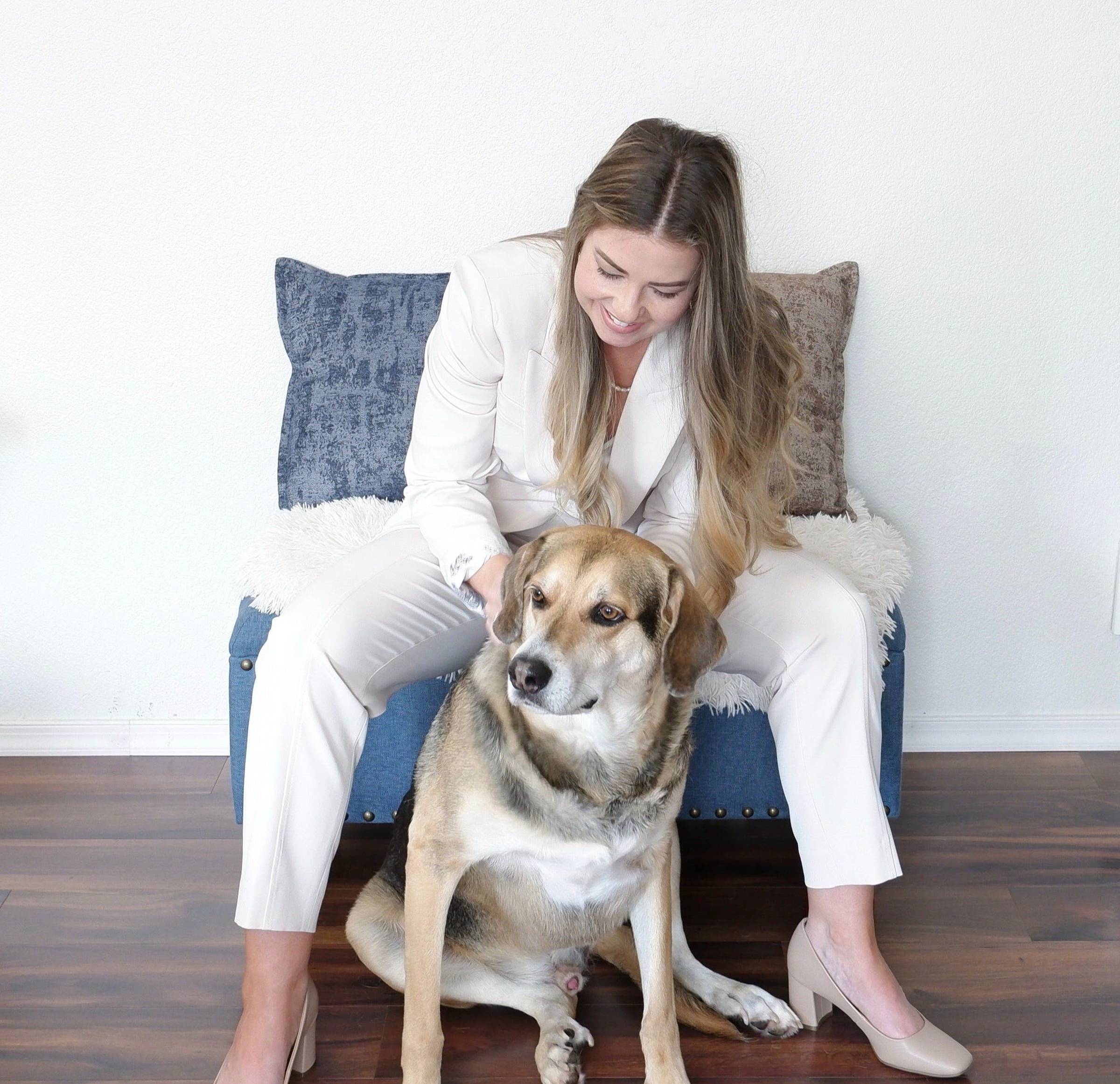 woman in black blazer and black pants standing on road during daytime