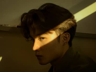 Young man's eye caught in the light