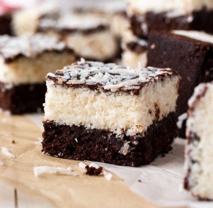 Closeup of a chocolate coconut brownie showing the coconut layer inside.