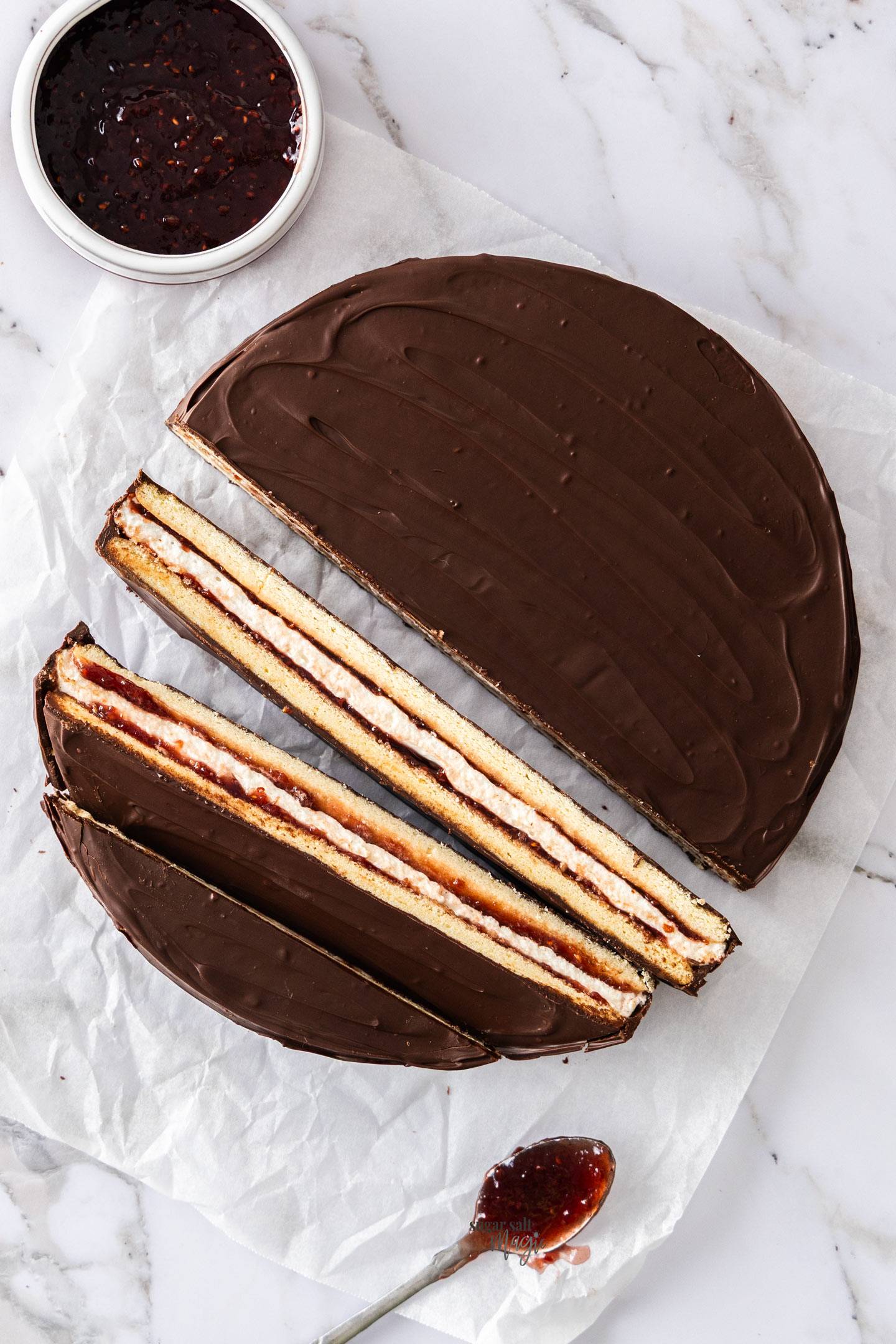 Top down view of a giant wagon wheel with the lower half cut into long bars.