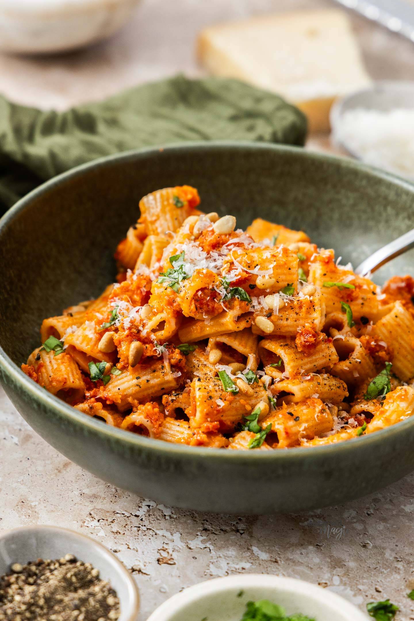 A bowl filled with sundried tomato pasta.