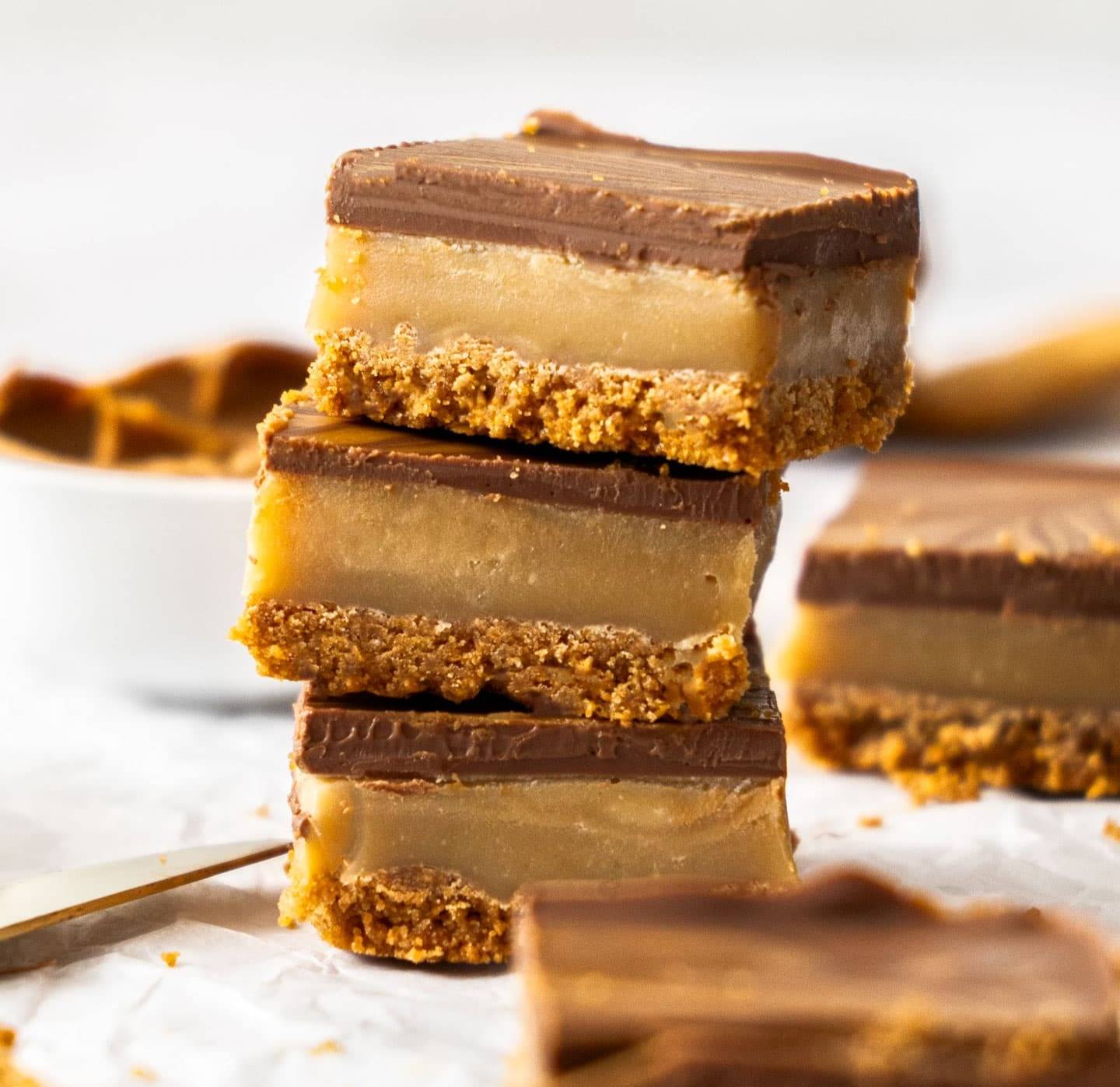 A stack of 3 Biscoff millionaires slice.
