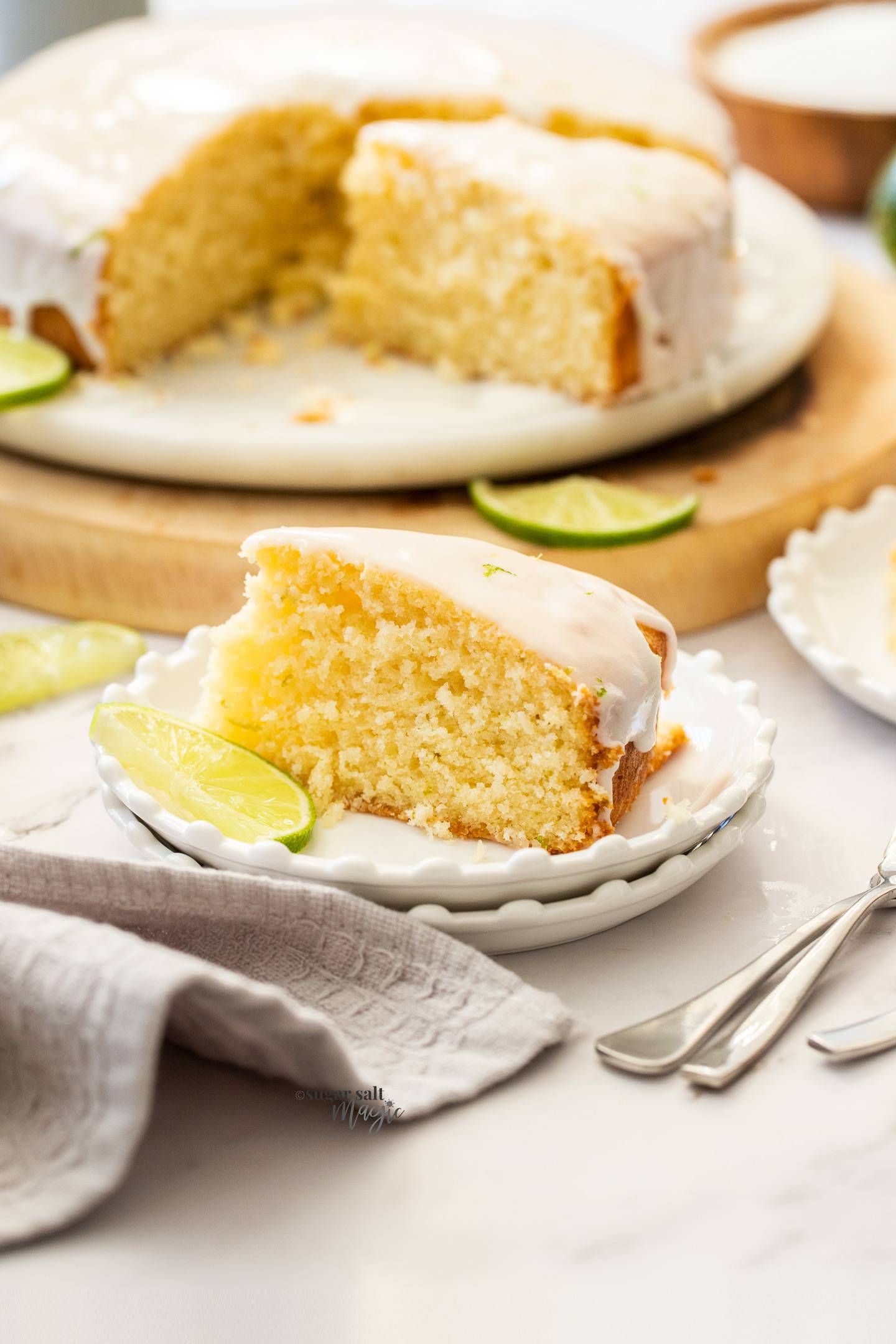 A slice of lime cake on a small dessert plate.