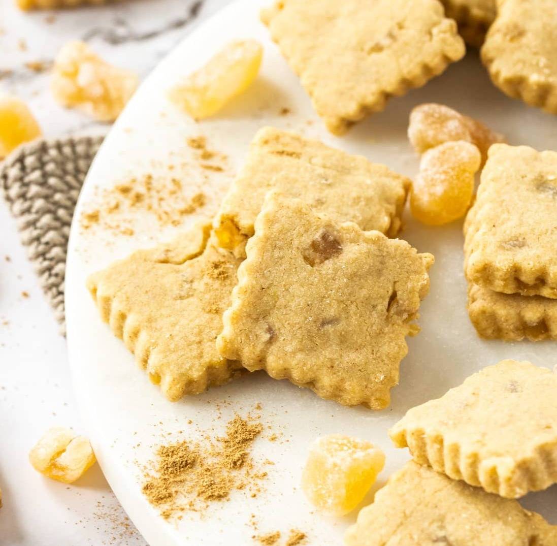 A batch of ginger shortbread on a marble platter.