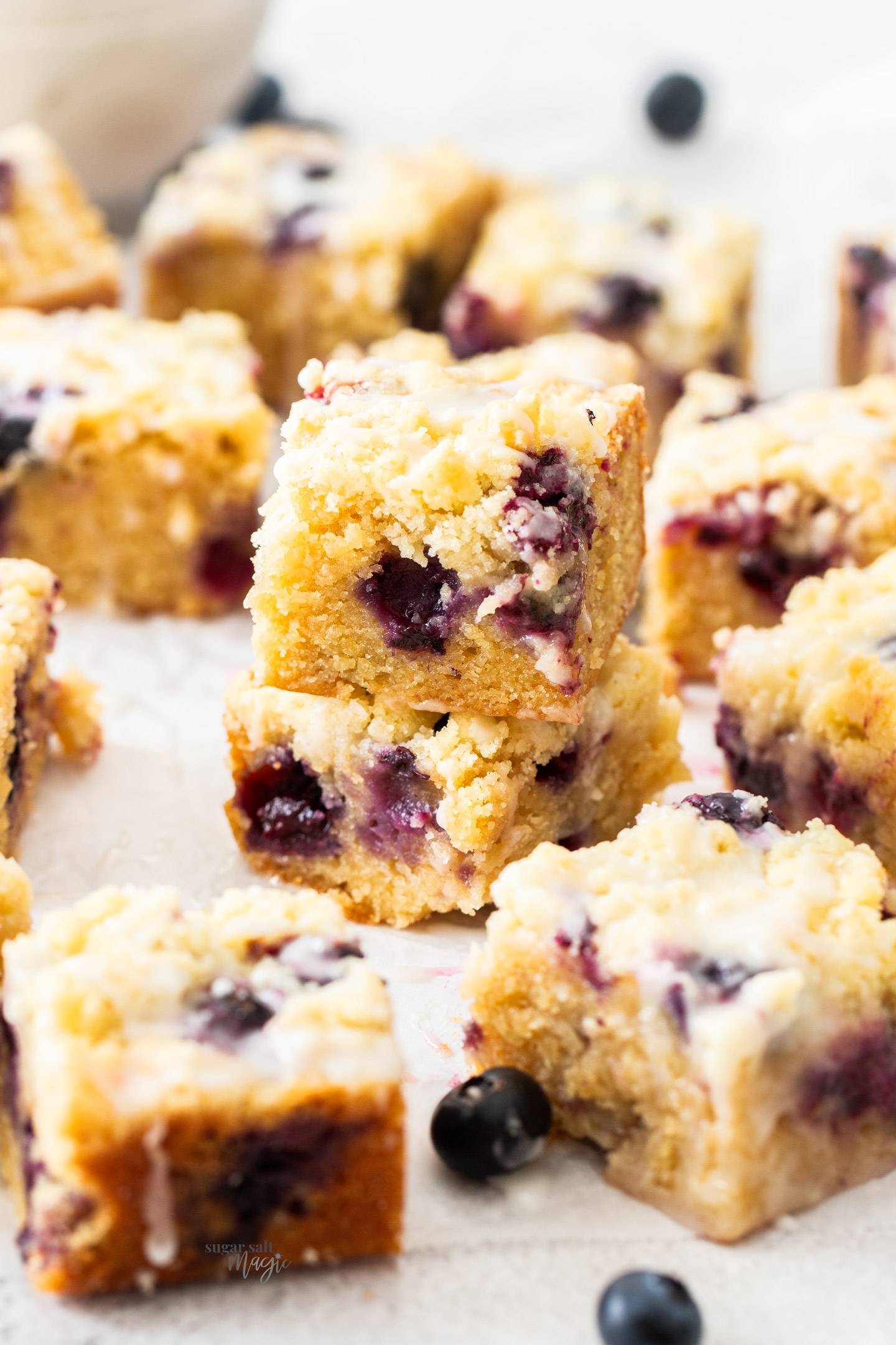 Closeup of a stack of 2 blueberry blondies.