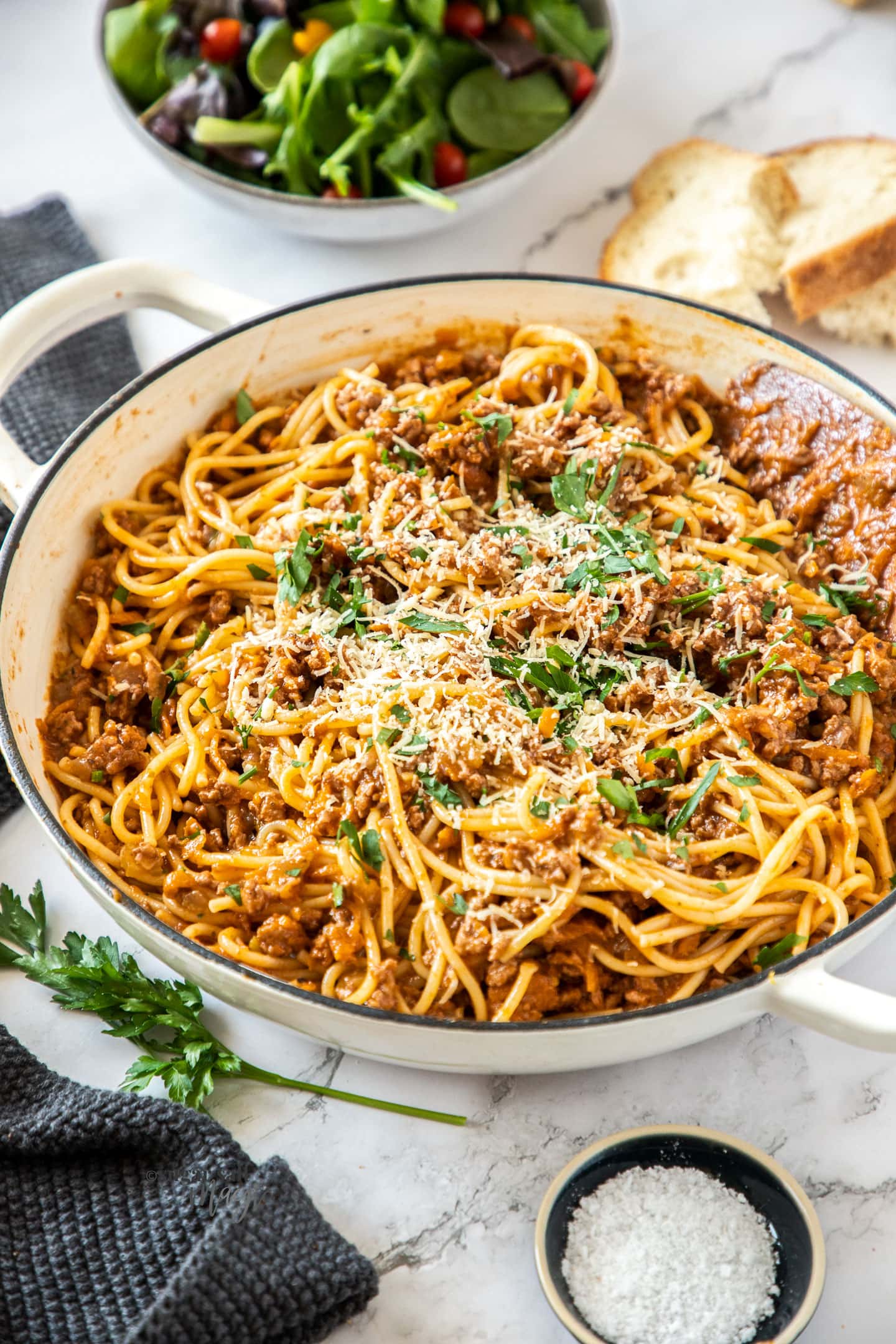 Closeup of a pan full of spaghetti bolognese.