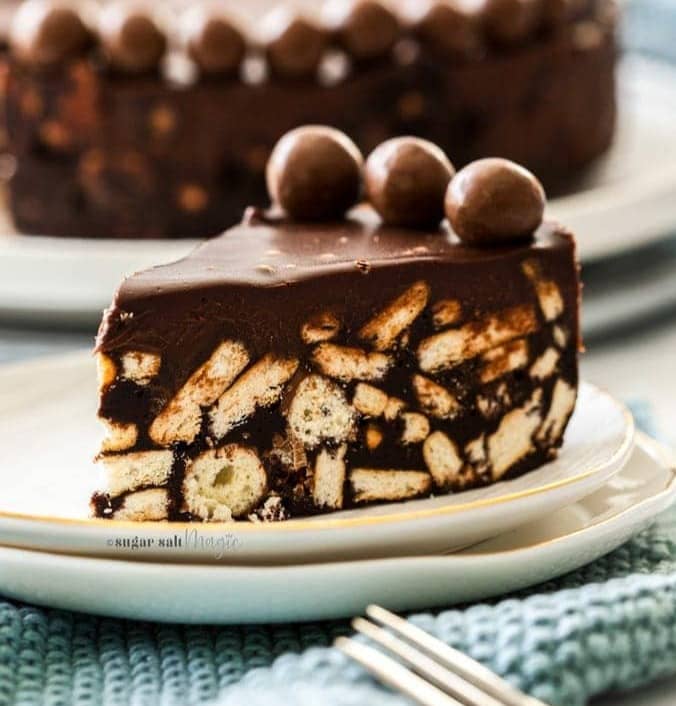 A slice of chocolate fridge cake on a dessert plate.