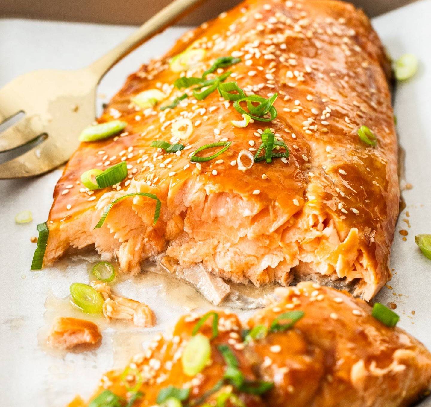 A whole side of salmon broken open to show the inside. 