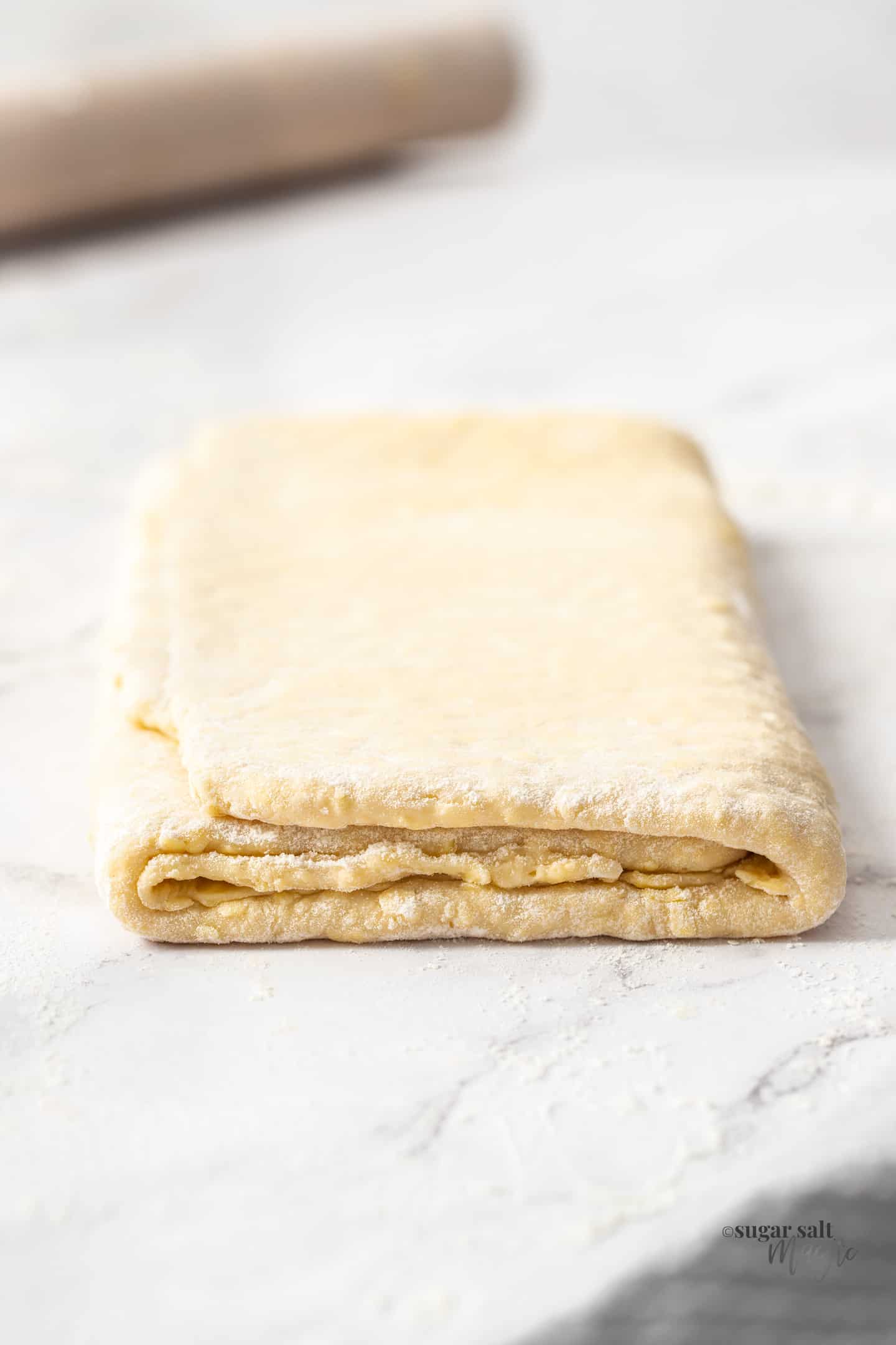 A block of homemade danish dough.