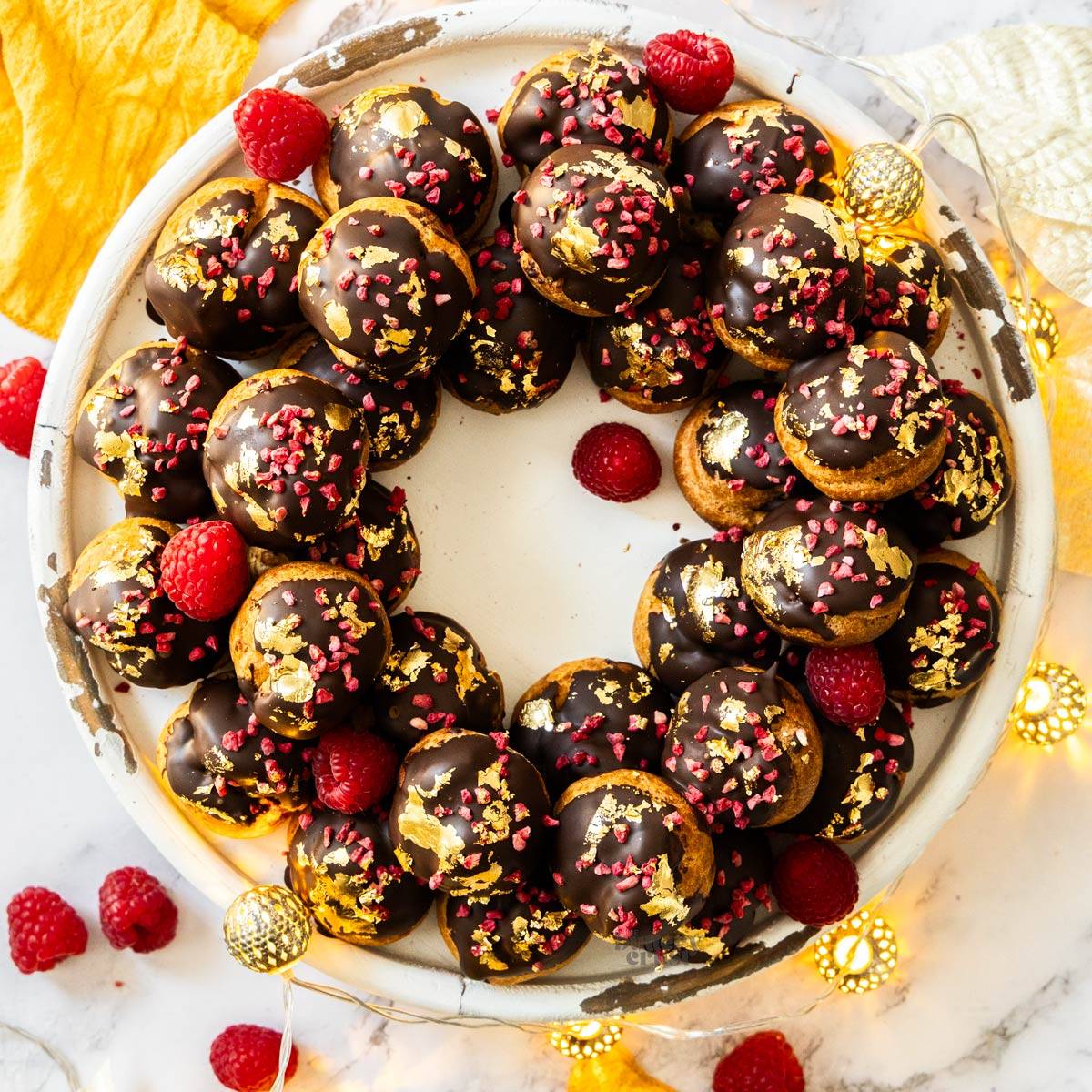 Top down view of a wreath of profiteroles.