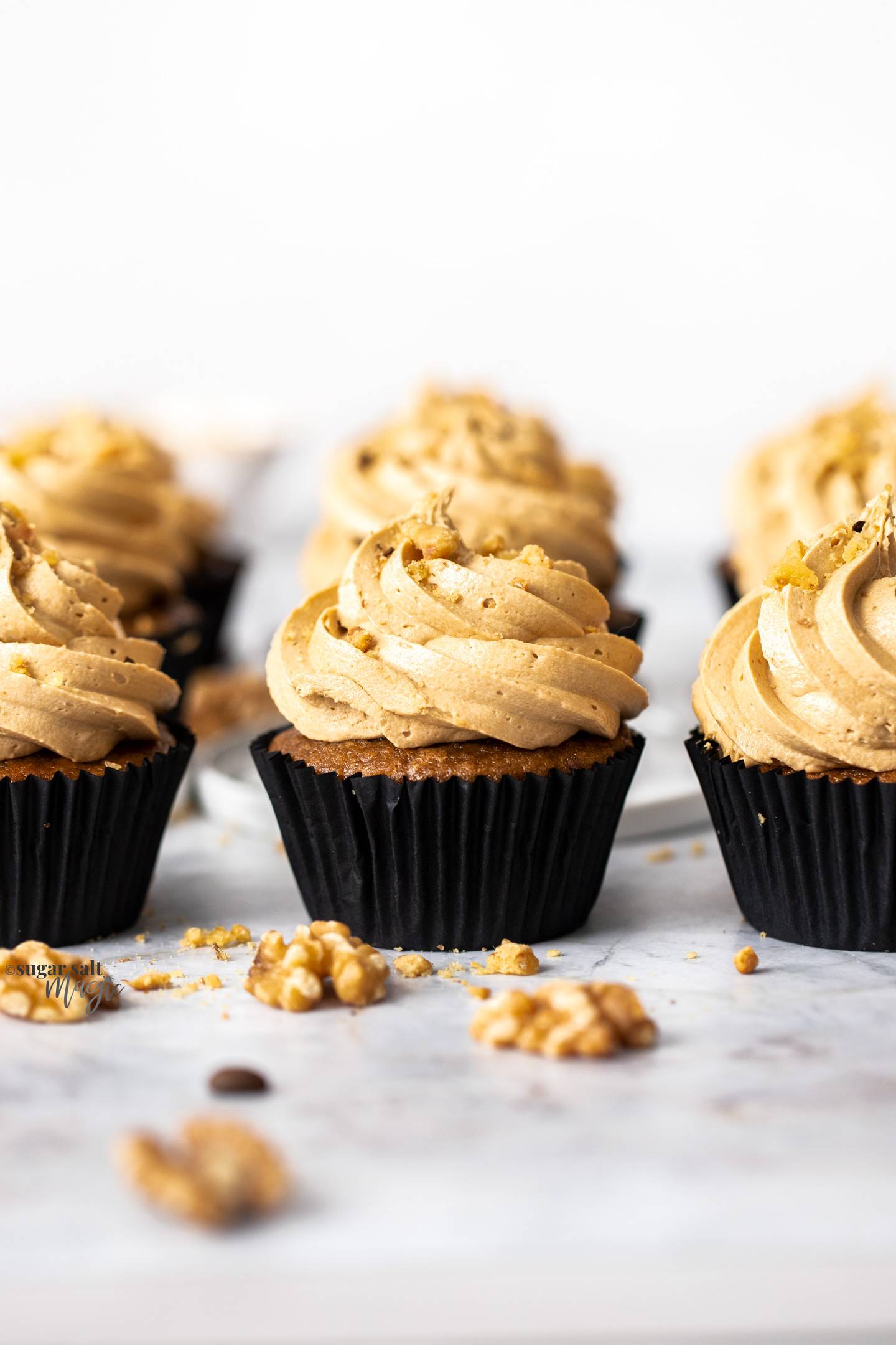 3 coffee and walnut cupcakes in a row.
