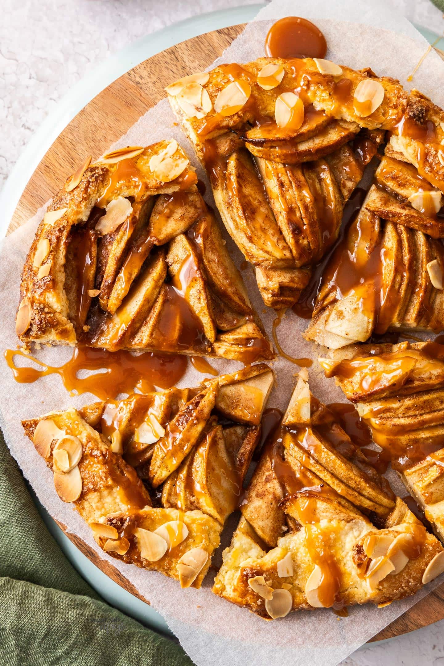 Top down view of an apple crostata cut into slices.