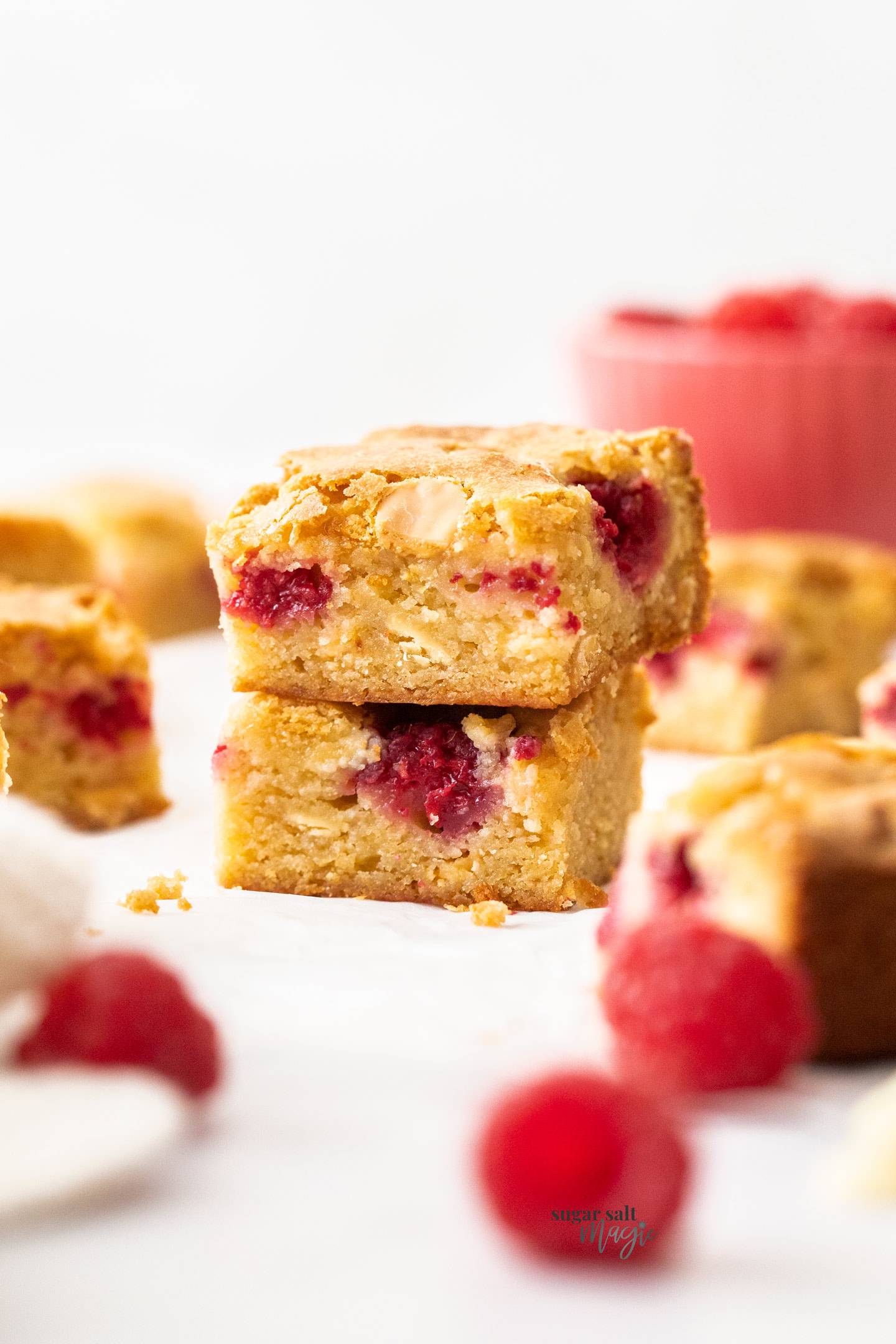 A stack of two white chocolate raspberry blondies.
