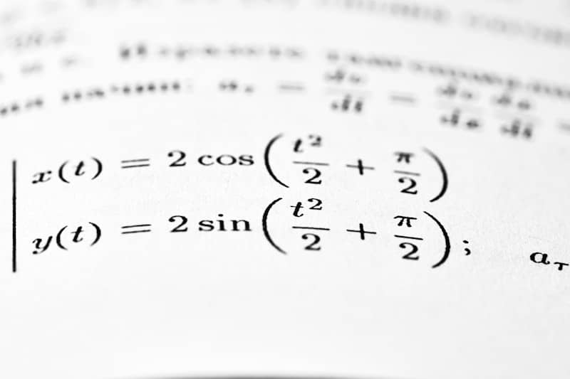 Mathematical equations are shown on a printed page.