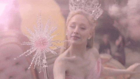 Galinda the Good Witch popping a bubble