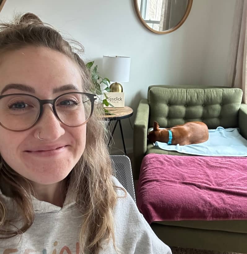 Hayley working with Poppy asleep in the background