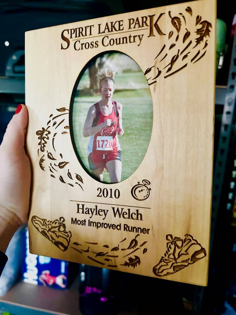 A plaque of Hayley and her "Most Improved Runner" award from high school cross country