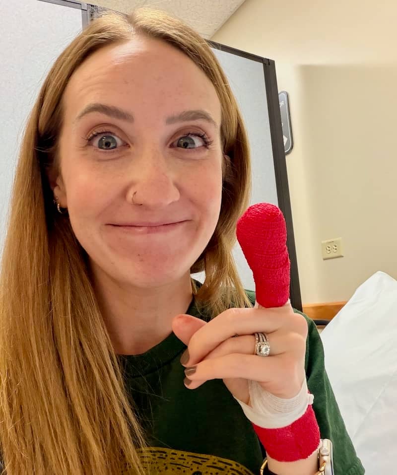 Hayley with a comically large red bandage on her finger